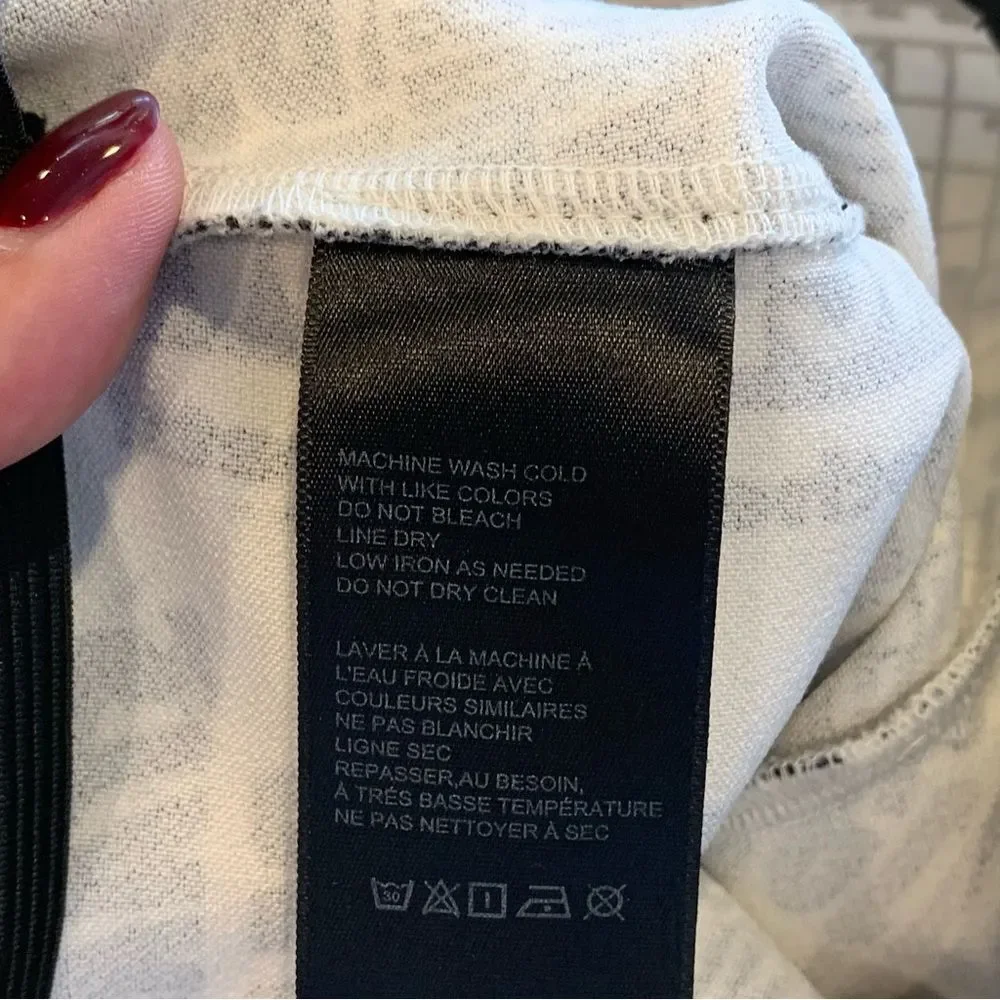 Urban Outfitters DALILA LOW RISE FLARE PANT Newspaper Crossword Print Size S - Picture 9 of 12